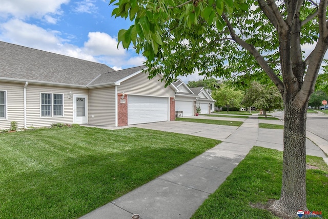 3934 Ballard Ct, Lincoln, NE 68504 - view of front facade featuring a garage, concrete driveway, a front lawn, a shingled roof, and brick siding