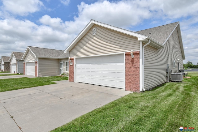 3934 Ballard Ct, Lincoln, NE 68504 - view of front of home with a garage, driveway, a front lawn, and brick siding