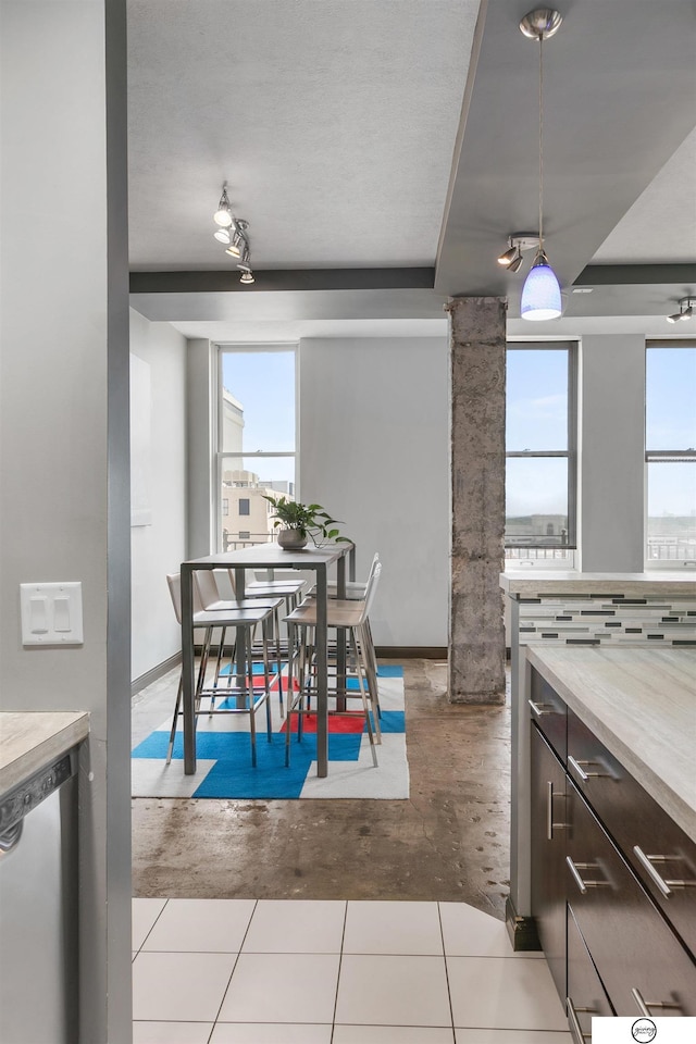 100 N 12th St Unit 904, Lincoln, NE 68508 - dining room featuring plenty of natural light and baseboards