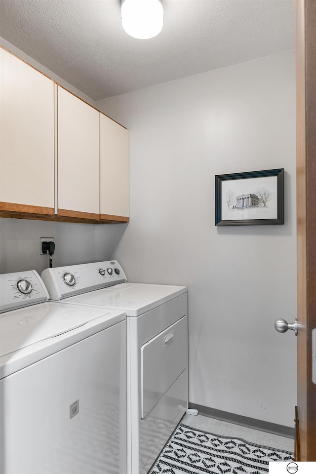 100 N 12th St Unit 904, Lincoln, NE 68508 - laundry area with cabinet space, washer and dryer, and baseboards