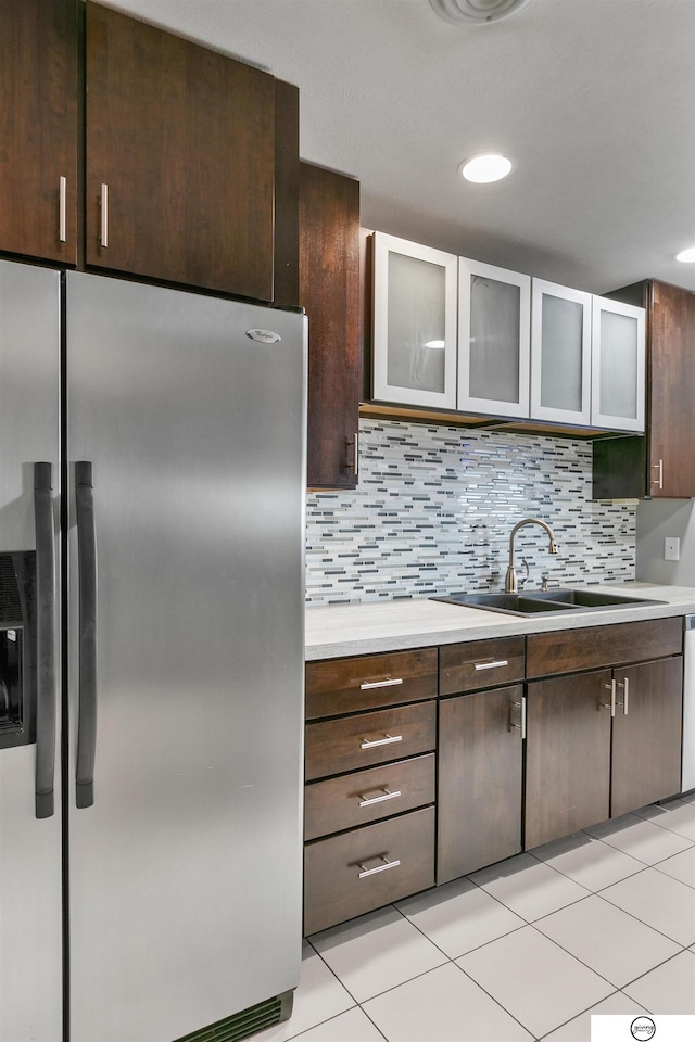 100 N 12th St Unit 904, Lincoln, NE 68508 - kitchen with stainless steel refrigerator with ice dispenser, a sink, light countertops, dark brown cabinetry, and recessed lighting