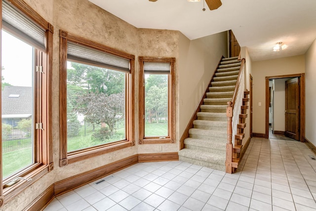 8240 Dorset Dr, Lincoln, NE 68510 - staircase featuring baseboards, tile patterned flooring, and a ceiling fan