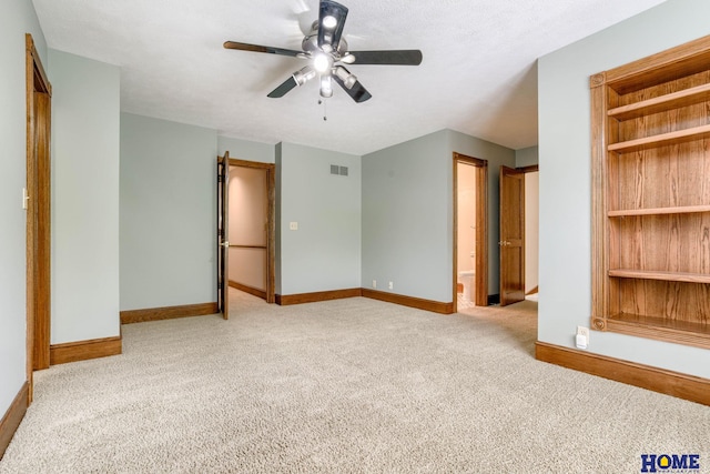8240 Dorset Dr, Lincoln, NE 68510 - spare room featuring carpet flooring, ceiling fan, and baseboards
