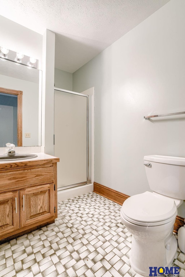 8240 Dorset Dr, Lincoln, NE 68510 - full bath featuring vanity, a shower stall, toilet, and baseboards