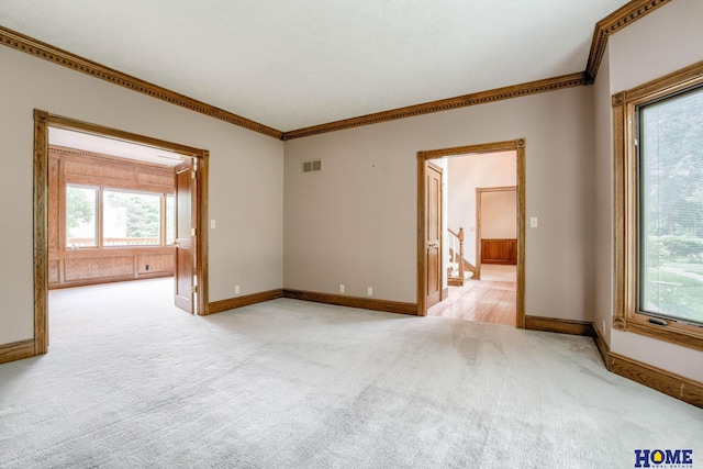 8240 Dorset Dr, Lincoln, NE 68510 - unfurnished room with light colored carpet, crown molding, healthy amount of natural light, and baseboards