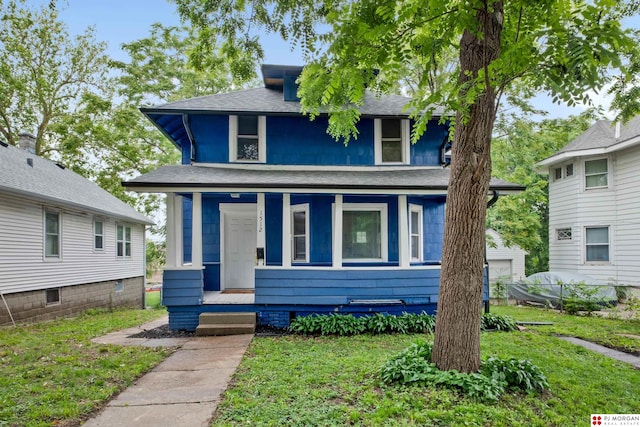1512 N 41st Ave, Omaha, NE 68111 - american foursquare style home featuring a porch, a front yard, and roof with shingles