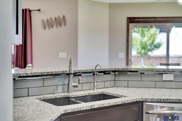 1309 Ridge Rd, Hickman, NE 68372 - kitchen with dishwasher and light stone countertops