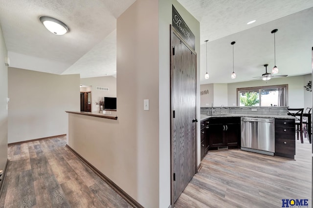 1309 Ridge Rd, Hickman, NE 68372 - corridor featuring light wood finished floors, a textured ceiling, and lofted ceiling