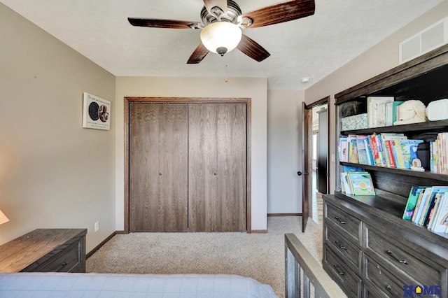 1309 Ridge Rd, Hickman, NE 68372 - bedroom with carpet floors, a closet, and a ceiling fan