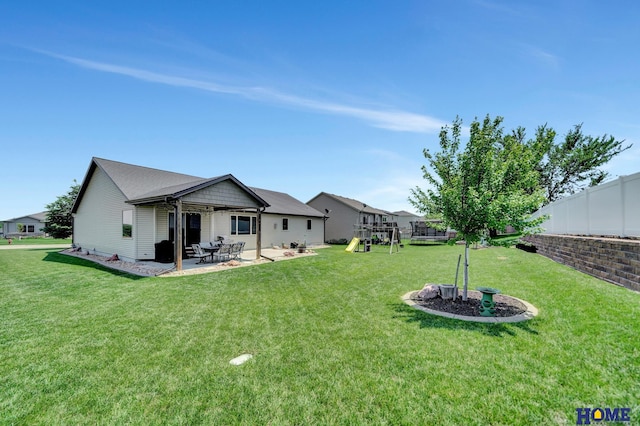 1309 Ridge Rd, Hickman, NE 68372 - rear view of property featuring a playground and a patio area