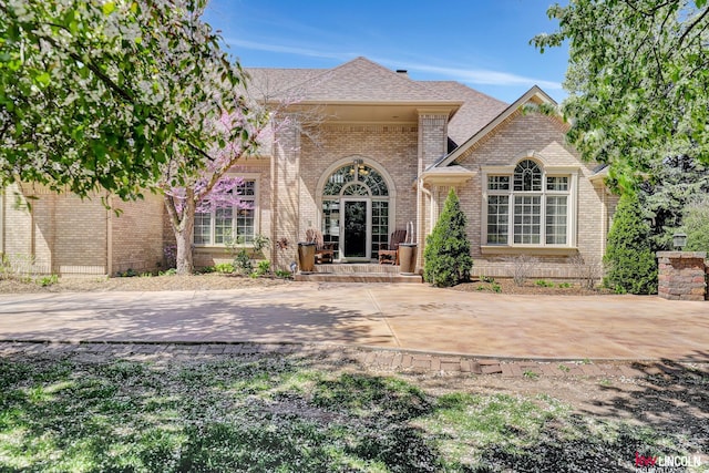 5100 Bridle Ln, Lincoln, NE 68516 - rear view of property with brick siding and roof with shingles