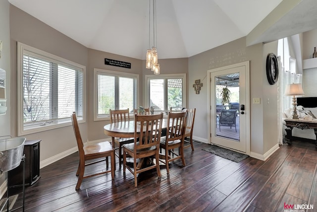 5100 Bridle Ln, Lincoln, NE 68516 - dining room featuring dark wood finished floors, baseboards, and high vaulted ceiling