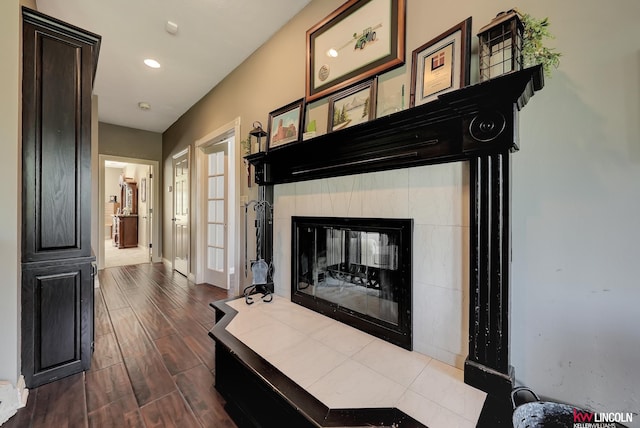 5100 Bridle Ln, Lincoln, NE 68516 - detailed view of wood finished floors, baseboards, a fireplace, and recessed lighting