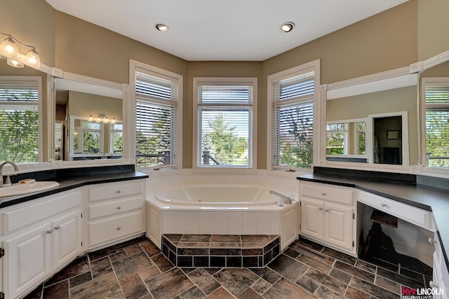5100 Bridle Ln, Lincoln, NE 68516 - bathroom featuring vanity, healthy amount of natural light, a bath, and recessed lighting