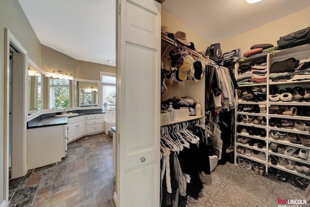 5100 Bridle Ln, Lincoln, NE 68516 - spacious closet featuring a sink and stone tile floors