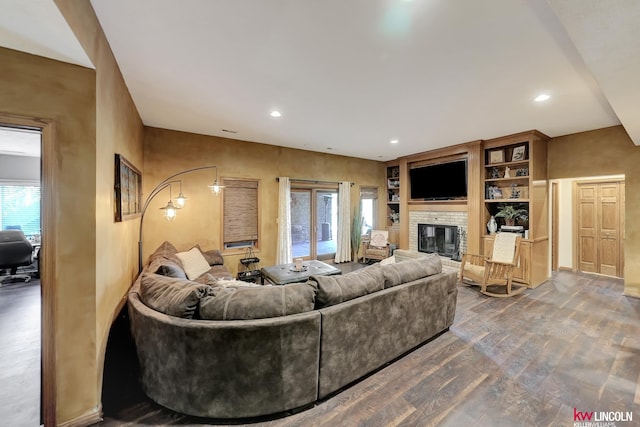 5100 Bridle Ln, Lincoln, NE 68516 - living room featuring wood finished floors, a fireplace, recessed lighting, and built in features