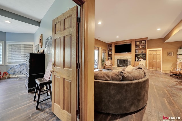 5100 Bridle Ln, Lincoln, NE 68516 - living room featuring wood finished floors, recessed lighting, a fireplace, plenty of natural light, and baseboards
