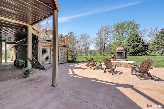 5100 Bridle Ln, Lincoln, NE 68516 - view of patio / terrace featuring exterior fireplace