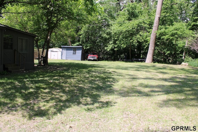 23809 F Plz Unit 9, Waterloo, NE 68069 - view of green lawn featuring entry steps