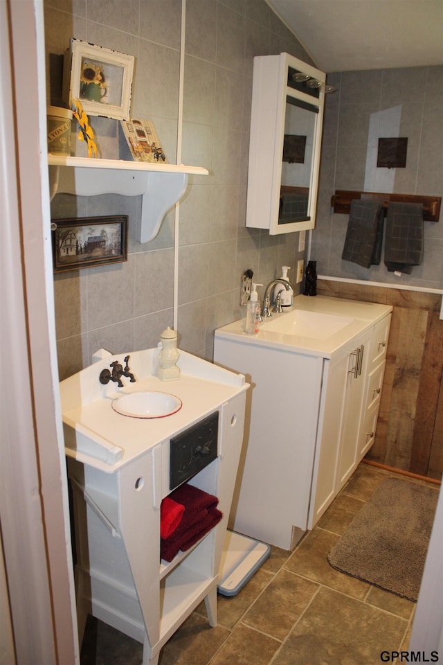 23809 F Plz Unit 9, Waterloo, NE 68069 - bathroom featuring tile walls, vanity, and backsplash