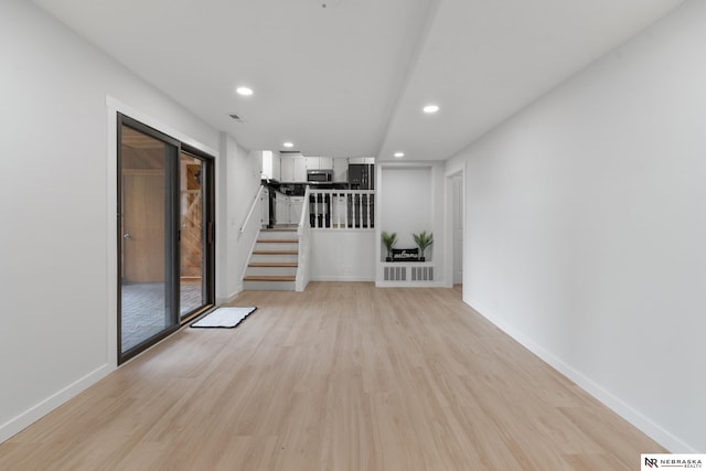 14611 Holmes St, Omaha, NE 68137 - empty room with light wood-style floors, recessed lighting, stairway, and baseboards