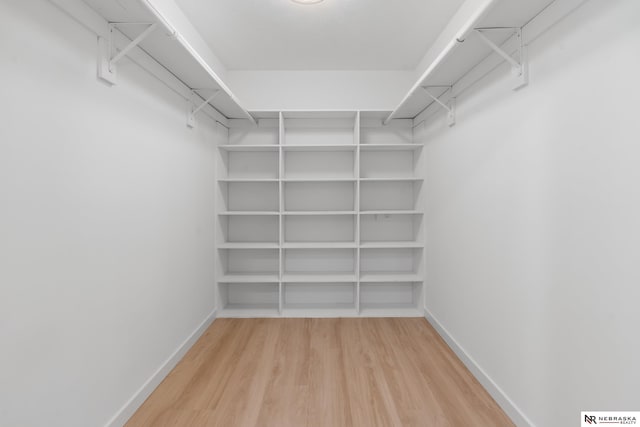 14611 Holmes St, Omaha, NE 68137 - spacious closet featuring wood finished floors