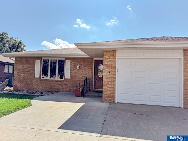 1881 Meadow Ln, Seward, NE 68434 - view of front of house featuring driveway, brick siding, and an attached garage