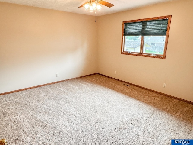 1881 Meadow Ln, Seward, NE 68434 - carpeted spare room with a ceiling fan and baseboards