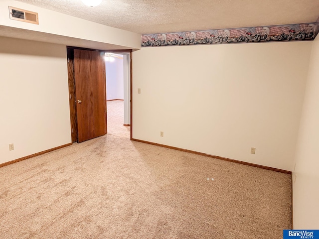 1881 Meadow Ln, Seward, NE 68434 - empty room featuring carpet floors, a textured ceiling, and baseboards