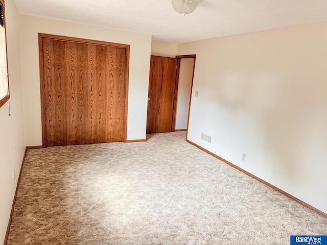 1881 Meadow Ln, Seward, NE 68434 - unfurnished bedroom featuring a closet, baseboards, and carpet