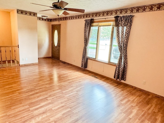 1881 Meadow Ln, Seward, NE 68434 - empty room featuring wood finished floors, a ceiling fan, and baseboards
