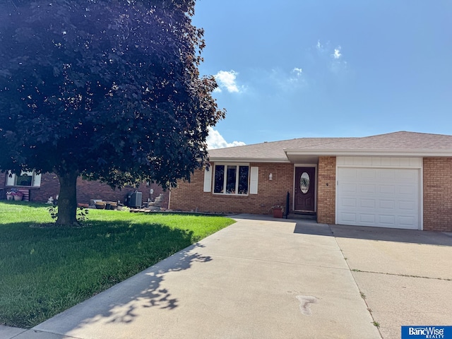 1881 Meadow Ln, Seward, NE 68434 - ranch-style house featuring driveway, a garage, a front yard, and brick siding
