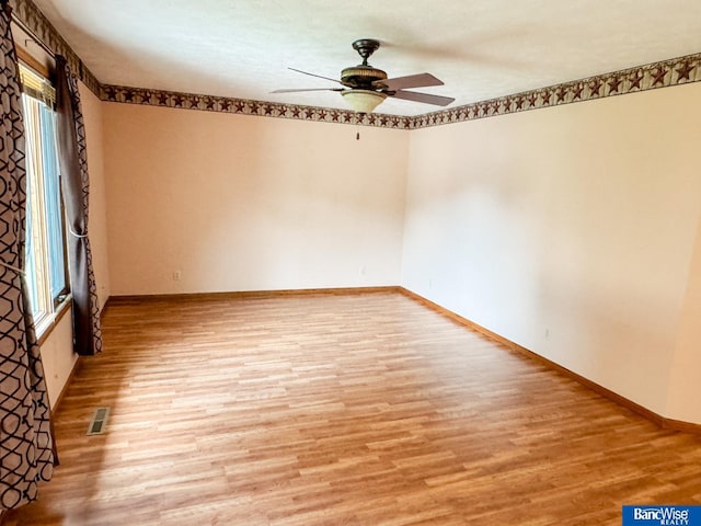 1881 Meadow Ln, Seward, NE 68434 - empty room with light wood-style flooring, ceiling fan, and baseboards