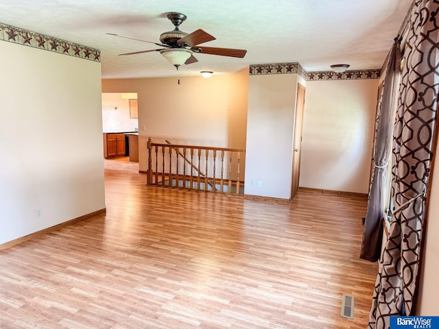 1881 Meadow Ln, Seward, NE 68434 - unfurnished room featuring light wood-type flooring, ceiling fan, and baseboards