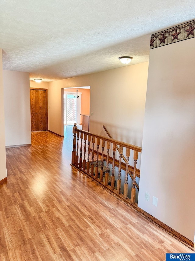 1881 Meadow Ln, Seward, NE 68434 - unfurnished room with wood finished floors, a textured ceiling, and baseboards