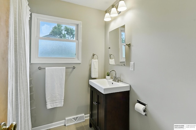 8345 Burt St, Omaha, NE 68114 - bathroom featuring vanity and baseboards