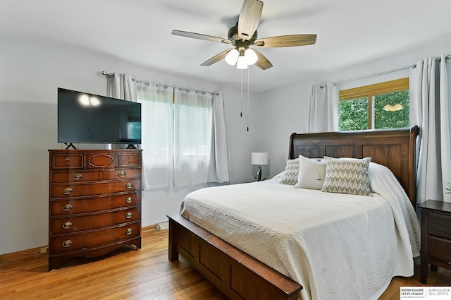 8345 Burt St, Omaha, NE 68114 - bedroom with light wood-style flooring and ceiling fan