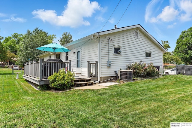 8345 Burt St, Omaha, NE 68114 - rear view of property with a deck and a lawn