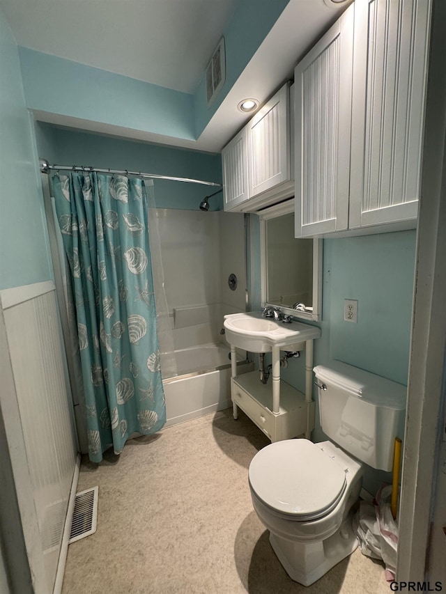 6035 Woolworth Ave, Omaha, NE 68106 - bathroom with shower / bath combo, toilet, and a sink