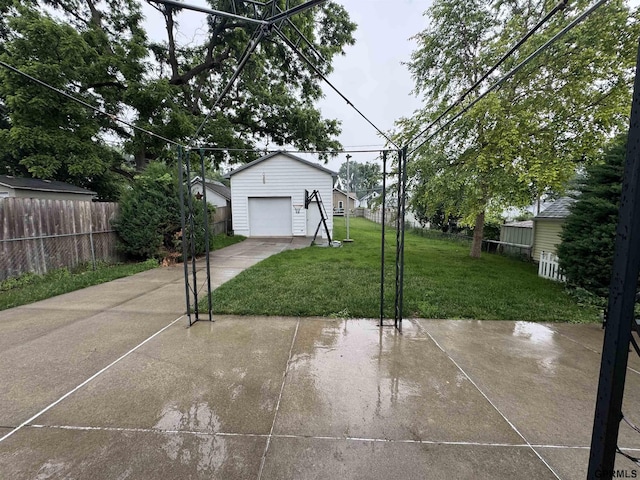 6035 Woolworth Ave, Omaha, NE 68106 - view of patio with driveway, an outdoor structure, and a garage