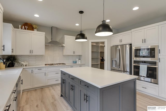 5807 N Hws Cleveland Blvd, Omaha, NE 68116 - kitchen featuring stainless steel appliances, wall chimney exhaust hood, gray cabinetry, white cabinets, and recessed lighting