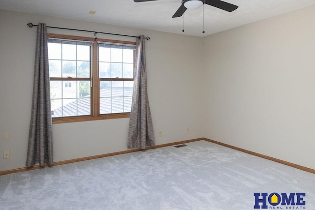 6207 Benjamin Pl, Lincoln, NE 68516 - carpeted empty room with plenty of natural light, ceiling fan, and baseboards