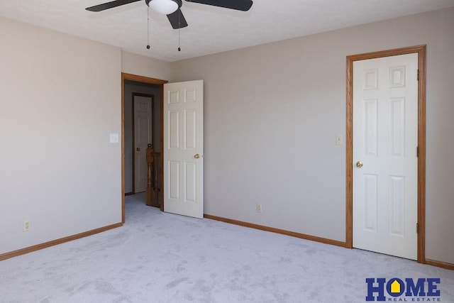 6207 Benjamin Pl, Lincoln, NE 68516 - unfurnished room featuring a ceiling fan, baseboards, and light carpet