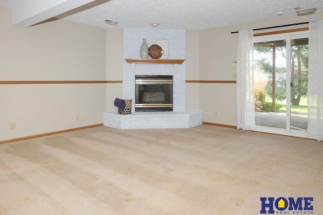 6207 Benjamin Pl, Lincoln, NE 68516 - unfurnished living room featuring a brick fireplace, carpet, baseboards, and a textured ceiling