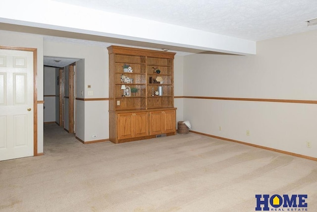 6207 Benjamin Pl, Lincoln, NE 68516 - empty room featuring light colored carpet, a textured ceiling, and baseboards