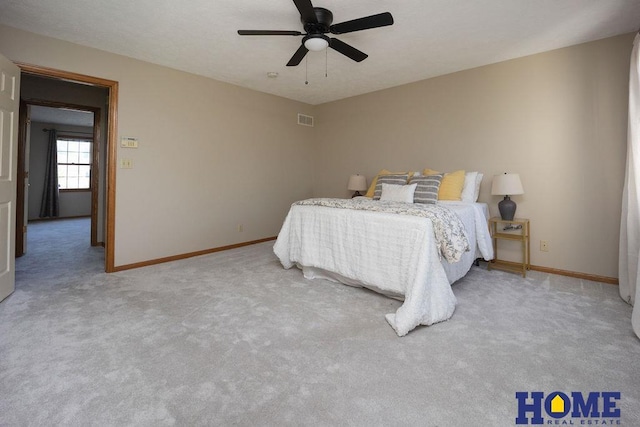 6207 Benjamin Pl, Lincoln, NE 68516 - bedroom with light carpet, baseboards, and ceiling fan