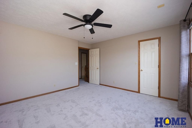6207 Benjamin Pl, Lincoln, NE 68516 - unfurnished bedroom featuring baseboards, carpet floors, and a ceiling fan