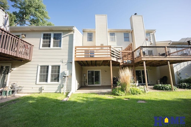 6207 Benjamin Pl, Lincoln, NE 68516 - rear view of house featuring a yard, a patio area, and a deck