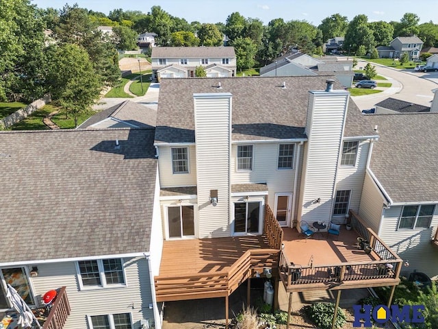 6207 Benjamin Pl, Lincoln, NE 68516 - rear view of property featuring a chimney, a shingled roof, a wooden deck, and a residential view