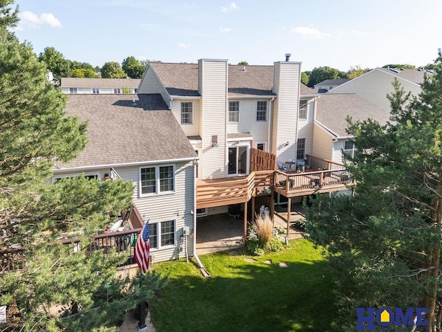 6207 Benjamin Pl, Lincoln, NE 68516 - rear view of property featuring a wooden deck, roof with shingles, and a lawn